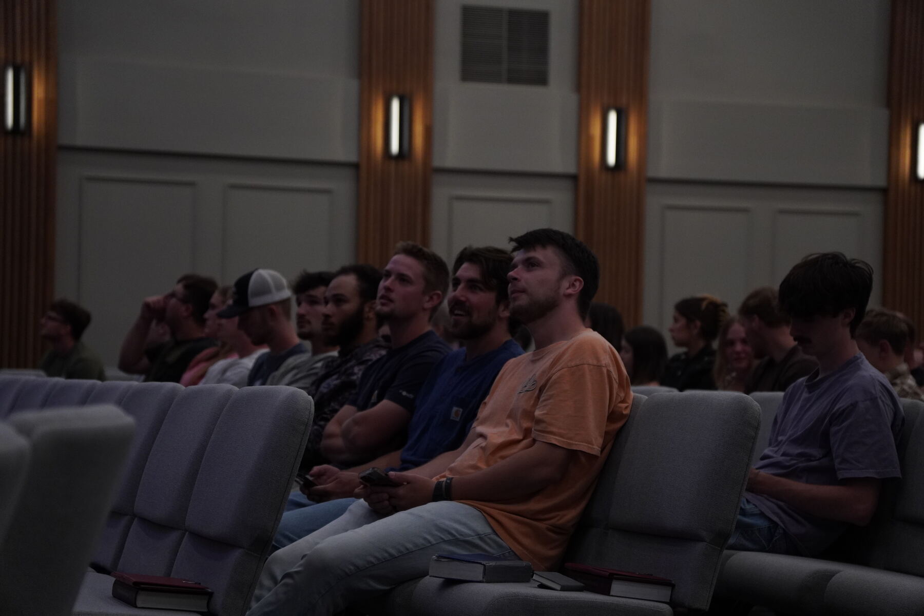 Hands raised as the congregation sings along with the lyrics
