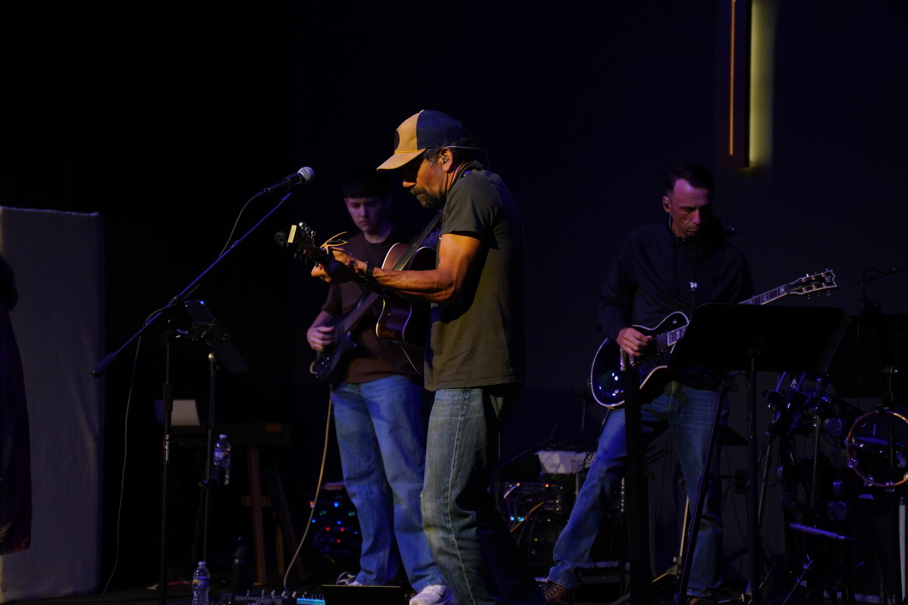 A man raises his hand in worship